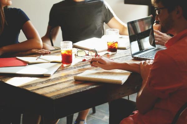 people working around a table